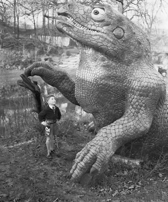 Framed Print : John Burwood Looking at a Dinosaur Sculpture Framed Print : John Burwood Looking at a Dinosaur Sculpture