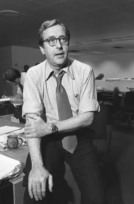 Framed Print : John Chancellor Sitting on Desk Framed Print : John Chancellor Sitting on Desk