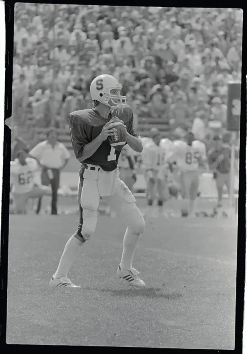 Framed Print : John Elway Holding The Football