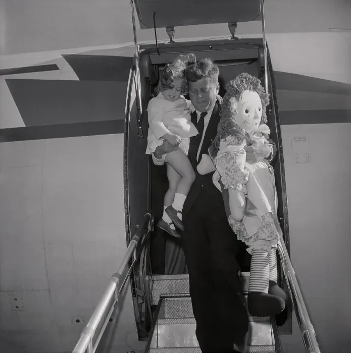 Framed Print : John F Kennedy Carrying His Daughter Caroline and Giant Doll Framed Print : John F Kennedy Carrying His Daughter Caroline and Giant Doll