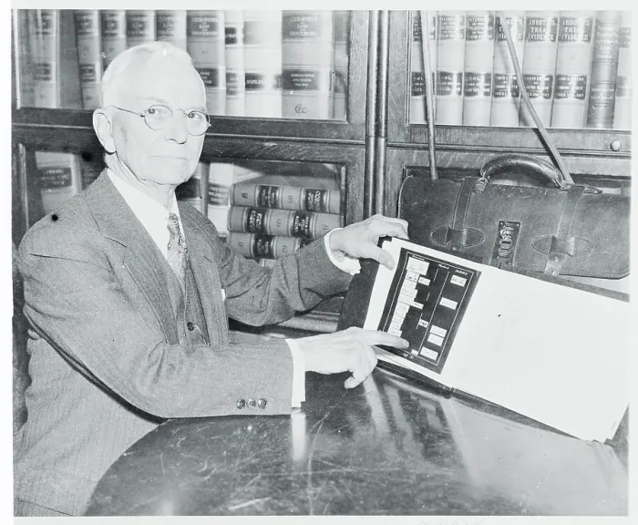 Framed Print : John F. Tyrrell Examining Evidence