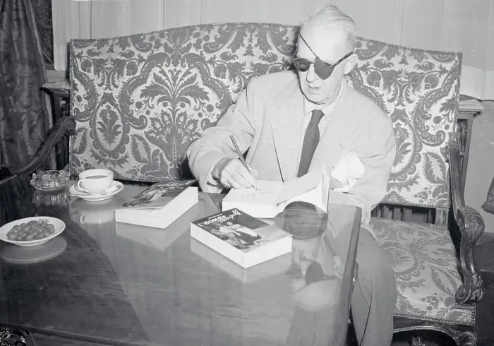 Framed Print : John Ford Autographing One of His Books Framed Print : John Ford Autographing One of His Books