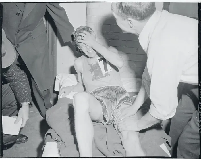 Framed Print : John J. Kelley Laying Down in Pain