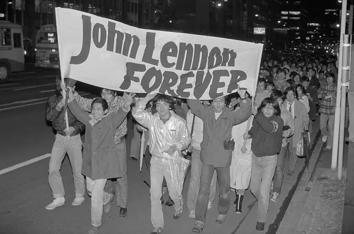 Framed Print : John Lennon Fans Marching with Banner in Tokyo