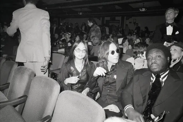 Framed Print : John Lennon and May Pang Seated in Theater Framed Print : John Lennon and May Pang Seated in Theater