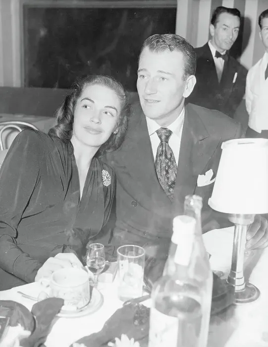 Framed Print : John Wayne and Esperanza Baur at Table Framed Print : John Wayne and Esperanza Baur at Table