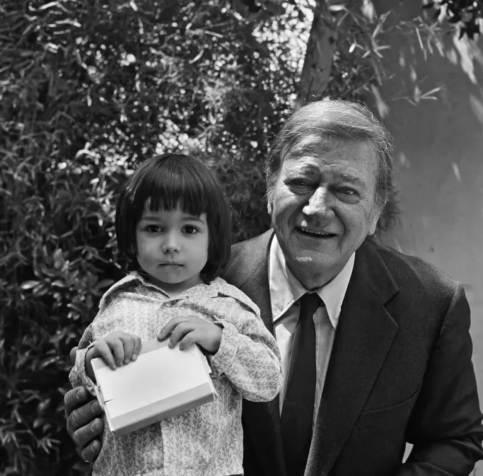 Framed Print : John Wayne Poses With A Little Girl Framed Print : John Wayne Poses With A Little Girl