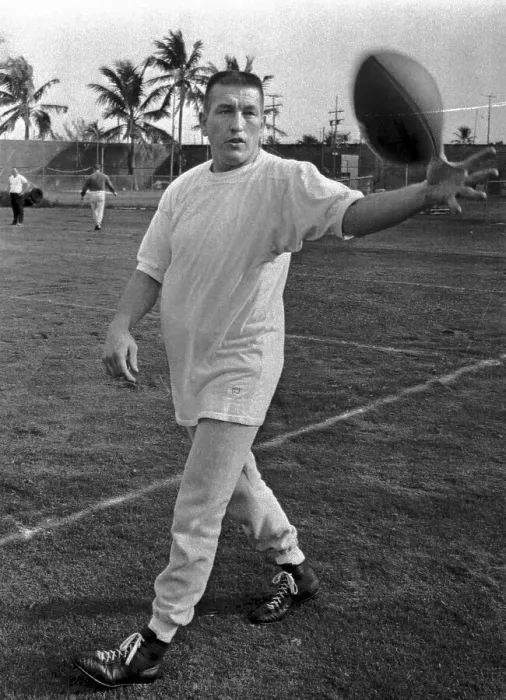 Framed Print : Johnny Unitas Reaching for Ball During Practice