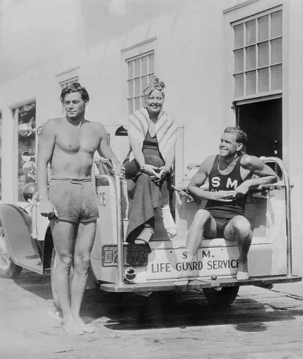 Framed Print : Johnny Weismuller and Thelma Todd with Lifeguard Framed Print : Johnny Weismuller and Thelma Todd with Lifeguard