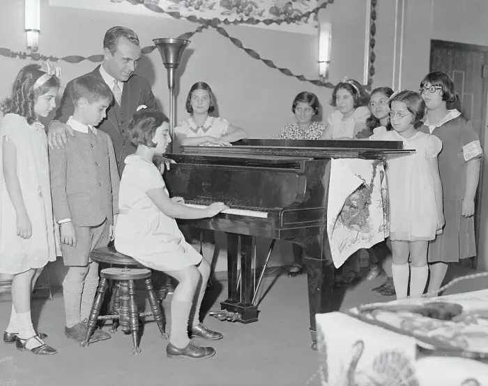 Framed Print : Jose Iturbi Listening to Children Playing Piano Framed Print : Jose Iturbi Listening to Children Playing Piano