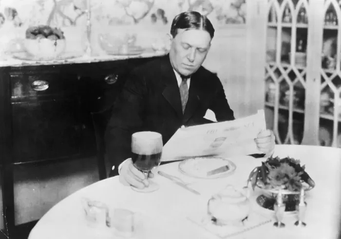 Framed Print : Journalist H.L. Mencken Reading Newspaper at Dining Table Framed Print : Journalist H.L. Mencken Reading Newspaper at Dining Table