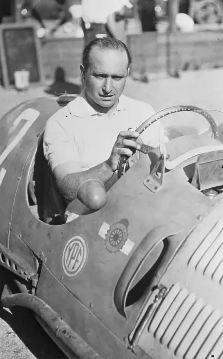 Framed Print : Juan Manuel Fangio Sitting in Race Car Framed Print : Juan Manuel Fangio Sitting in Race Car