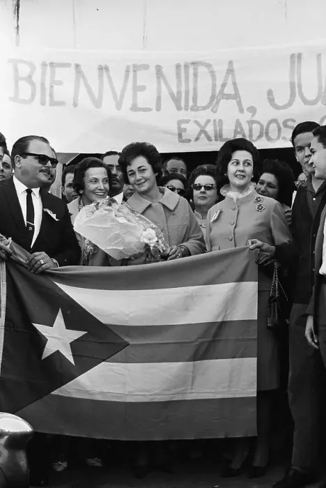 Framed Print : Juana Castro Holding Flowers Behind Cuban Flag Framed Print : Juana Castro Holding Flowers Behind Cuban Flag