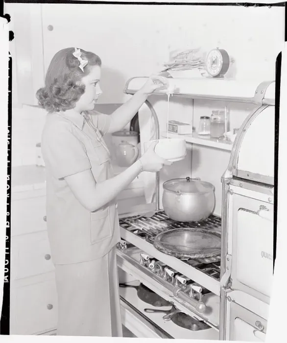Framed Print : Judy Garland Cooking at Stove Framed Print : Judy Garland Cooking at Stove
