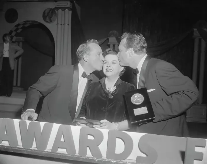 : Judy Garland Being Kissed by Bing Crosby and Red Skelton : Judy Garland Being Kissed by Bing Crosby and Red Skelton