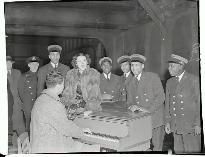 Framed Print : Judy Garland Singing with Train Station Employees at Piano Framed Print : Judy Garland Singing with Train Station Employees at Piano
