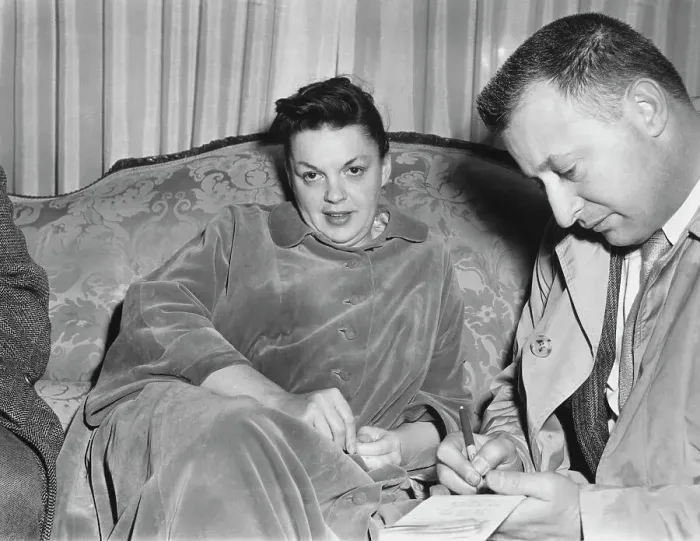 Framed Print : Judy Garland Sitting on Couch Framed Print : Judy Garland Sitting on Couch