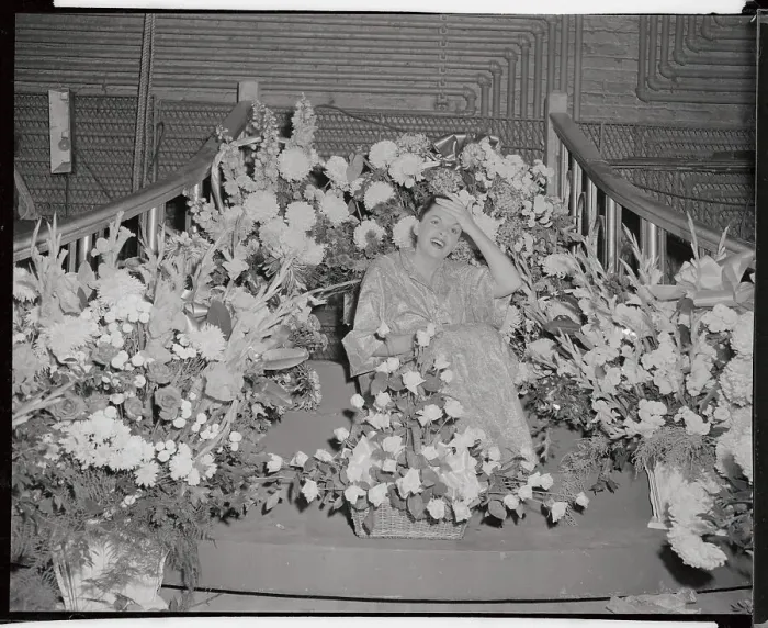 Framed Print : Judy Garland Sitting in Huge Flower Display Framed Print : Judy Garland Sitting in Huge Flower Display