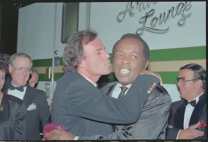 Framed Print : Julio Iglesias Kissing Lou Rawls Framed Print : Julio Iglesias Kissing Lou Rawls