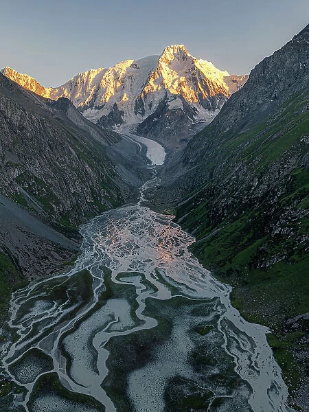 Karakol Mountain Peak and its glacial river at dusk, Issyk-Kul Region, Kyrgyzstan