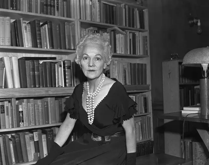 Framed Print : Katherine Anne Porter Sitting by Bookshelf Framed Print : Katherine Anne Porter Sitting by Bookshelf