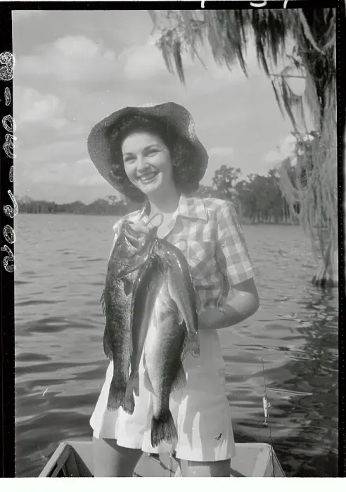 Framed Print : Kathleen Turner Displaying Fish She Caught Framed Print : Kathleen Turner Displaying Fish She Caught