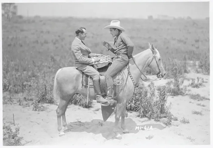 Framed Print : Ken Maynard and Al Rogell Playing Checkers Atop Horse Framed Print : Ken Maynard and Al Rogell Playing Checkers Atop Horse