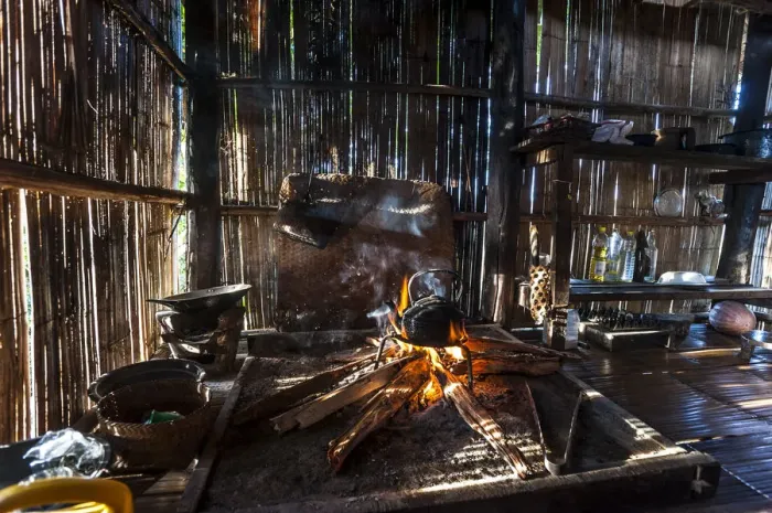 Framed Print : Kettle over an open fire in a kitchen made of bamboo, Lahu village, province of Mae Hong Song, Northern Thailand, Thailand