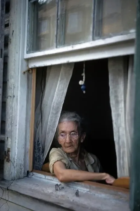 Framed Print : KEY WEST, FL - CIRCA 1946: A view as an old women looks out her window in Key West Framed Print : KEY WEST, FL - CIRCA 1946: A view as an old women looks out her window in Key West