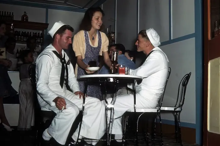 Framed Print : KEY WEST, FL - CIRCA 1946: A view as two navy sailors get a drink in Key West, Florida Framed Print : KEY WEST, FL - CIRCA 1946: A view as two navy sailors get a drink in Key West, Florida