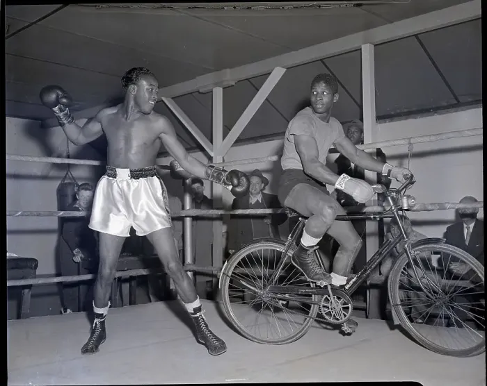Framed Print : Kid Gavilan In Ring with Man On Bicycle Framed Print : Kid Gavilan In Ring with Man On Bicycle