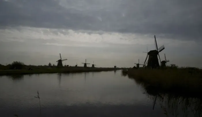 Framed Print : Kinderdijk view against the clouds