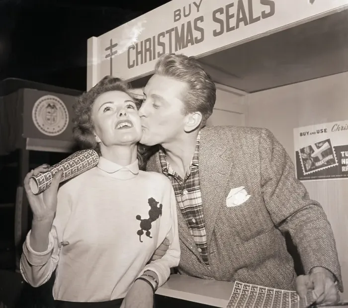 Framed Print : Kirk Douglas Kissing a Seal Customer Framed Print : Kirk Douglas Kissing a Seal Customer