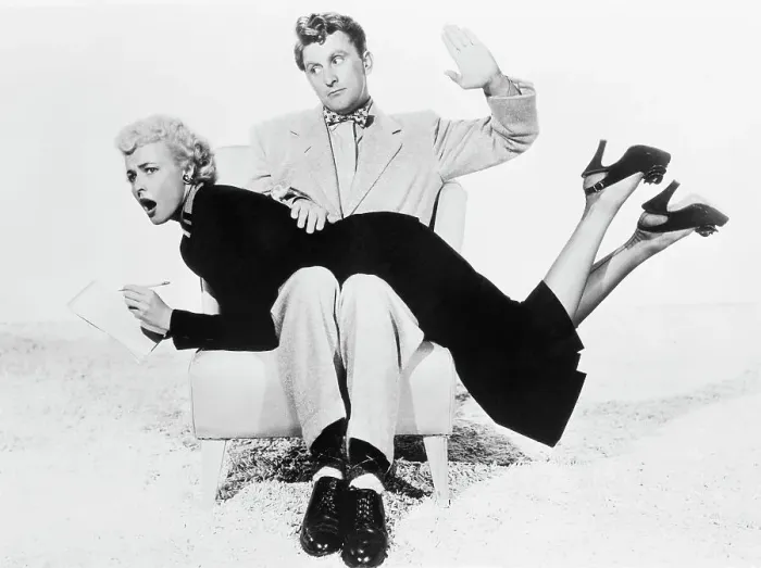 Framed Print : Kirk Douglas with Laraine Day over His Knee Framed Print : Kirk Douglas with Laraine Day over His Knee