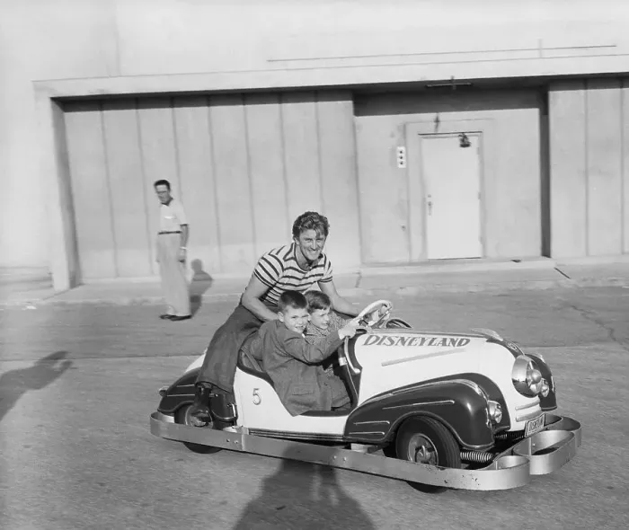 Framed Print : Kirk Douglas and Sons Driving Tiny Car Framed Print : Kirk Douglas and Sons Driving Tiny Car