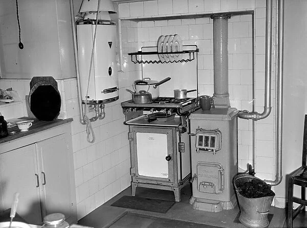 Kitchen. A Crane Carlton boiler beside a cooker and an Ascot heater