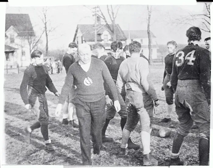Framed Print : Knute Rockne and Football Players Practicing on Field