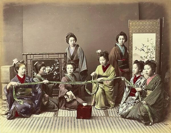 Konkonchiki, Japanese woman at a parlour game, a group of eight young woman, four of whom are holding a rope and playing a game while the others watch, c. 1870, Japan, Historic, digitally restored reproduction from an original of the period