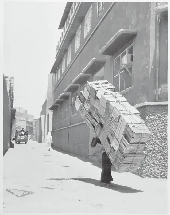 Framed Print : Kuwaiti Man Carrying Crates Framed Print : Kuwaiti Man Carrying Crates