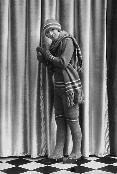 A La Mode. 1928: A knitted winter sports outfit in green wool