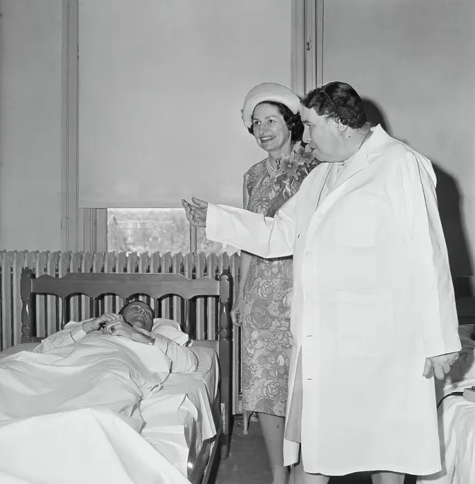 Framed Print : Lady Bird Johnson Speaking to a Bedridden Man Framed Print : Lady Bird Johnson Speaking to a Bedridden Man