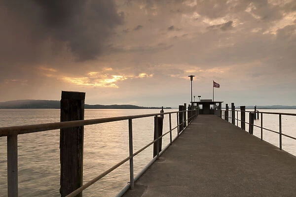 Lake Constance and approaching thunder clouds in the evening, pier in Mannenbach, Switzerland, Europe