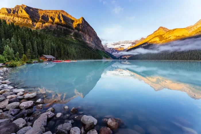 Framed Print : Lake Louise at sunrise, calm water and light on the mountain tops. Banff, Alberta, Canada