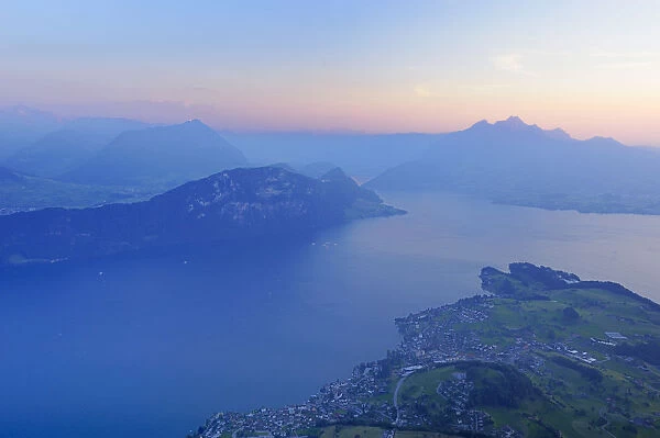 Lake Lucerne with the village of Weggis, in the distance, Pilatus Mountain, Lucerne, Switzerland, Europe