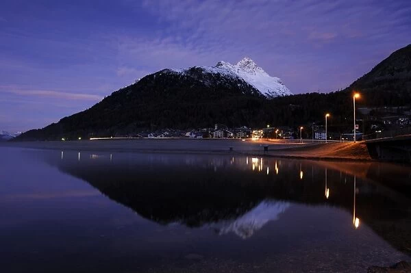 Lake Silvaplana with village of Silvaplana at dawn, St Moritz, Engadine, Grisons, Switzerland, Europe