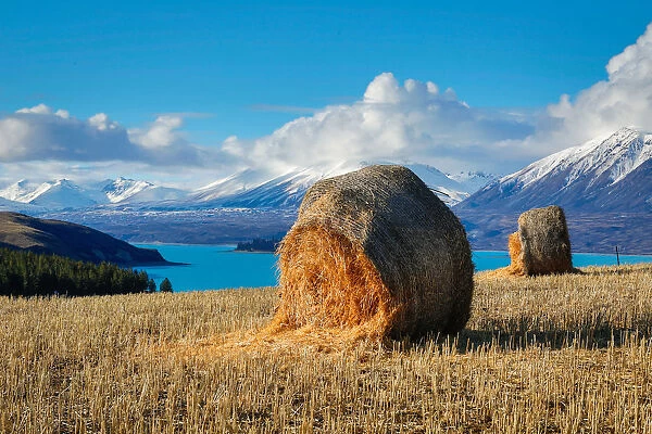 Lake Tekapo with hay bales and mountain background