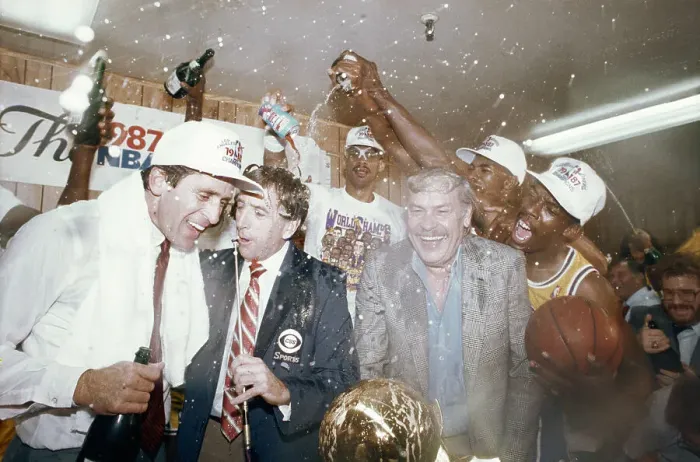 Framed Print : Lakers Kareem Abdul-Jabbar, Billy Thompson and Wes Matthews Shown Pouring Champagne on Laker Owner Jerry Buss and Coach Pat Riley as CBS Commentator Brent Musburger Tries to Interview Them Framed Print : Lakers Kareem Abdul-Jabbar, Billy Thompson and Wes Matthews Shown Pouring Champagne on Laker Owner Jerry Buss and Coach Pat Riley as CBS Commentator Brent Musburger Tries to Interview Them