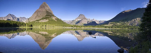 Landscape of Glacier National Park with mountains reflected in lake, Glacier National Park, Montana, USA