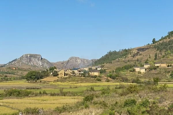 Landscape, village of the Betsileo people with terraced rice paddies, rocky mountains, Anja-Park near Ambalavao, Madagascar