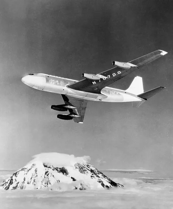 Framed Print : Large Aircraft Flying over Mountainous Region Framed Print : Large Aircraft Flying over Mountainous Region